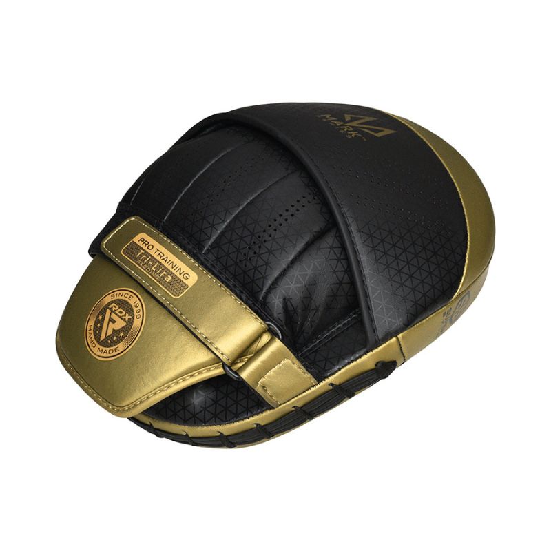 A black and gold curved boxing focus mitt with stitched details, labeled "Pro Training" on a strap, designed for martial arts or boxing training.
