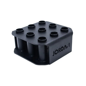 The JORDAN Olympic Bar Holder by Jordan is a black, rectangular rack with nine vertical slots for organizing Olympic bars upright, featuring the brand name cut out on the side.