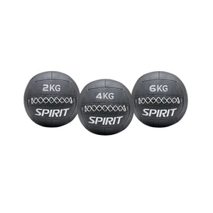 Three Spirit branded wall balls in different weights on a white background
