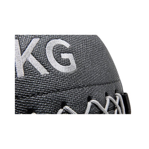Close-up of a grey wall ball with 'KG' branding on a white background