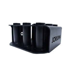 The JORDAN Olympic Bar Holder by Jordan is a black, rectangular rack with nine vertical slots for organizing Olympic bars upright, featuring the brand name cut out on the side.