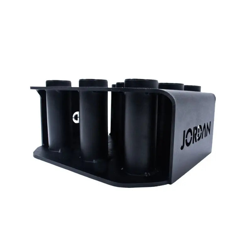 The JORDAN Olympic Bar Holder by Jordan is a black, rectangular rack with nine vertical slots for organizing Olympic bars upright, featuring the brand name cut out on the side.