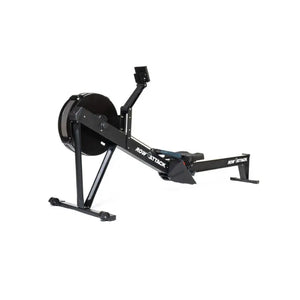 The Attack Fitness Indoor Rowing Machine offers low-impact, full-body cardio with a Bluetooth console and digital display—ideal for home workouts. Shown in black with footrests and flywheel against a white background.