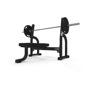 The JORDAN Olympic Flat Bench by Jordan is a black and gray UK-built commercial weight bench with a barbell and weights, ideal for upper-body strength training and Olympic Flat Bench press exercises, shown on a white background.