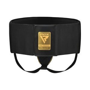 A black RDX Pro Training belt with gold accents, featuring a large rectangular front patch with the RDX logo and "Pro Training Tri-Lira" text. The belt has two leg straps and a wide, supportive waistband.