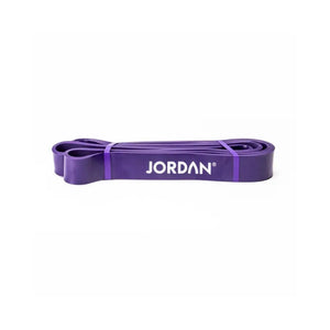 A flat purple JORDAN Power Band, coiled on a white background, features the brand name in white—perfect for strength, speed, and mobility training or pull-up assistance.