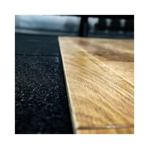 The Jordan UK-Made Weightlifting Platform – Heavy-Duty Strength Training Base features a central wooden section and black rubberized edges, ideal for gym or fitness use, and is shown on a white background.