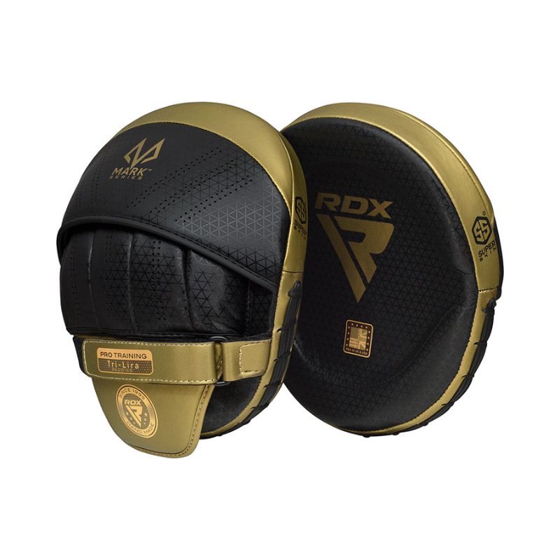 A pair of gold and black RDX Focus Pads for boxing or martial arts training, featuring a curved design, secure wrist straps, and branding on the front and back.