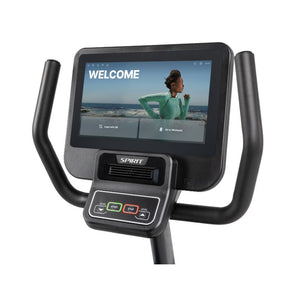 Exercise bike with a digital display showing a welcome screen on a white background