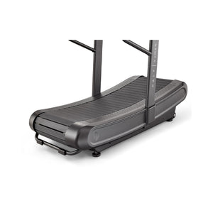A modern, curved manual treadmill with a black frame and slatted running surface, designed for running or walking without a motor.