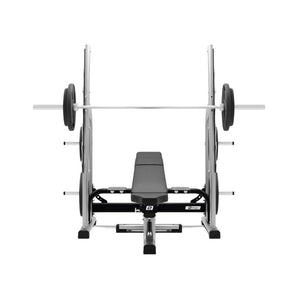 The Exigo Adjustable Olympic Bench – a commercial barbell bench by Exigo – is shown from the front with a loaded barbell on the rack, ideal for barbell training and set against a white background.