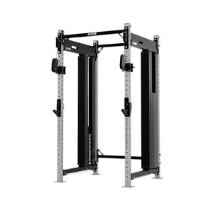 The EXIGO X70 Cable Power Rack by Exigo is a UK-built, freestanding commercial station with adjustable hooks and safety bars, designed for strength training and weightlifting. It features a black frame and silver upright posts.