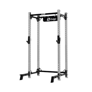 The Exigo X70 Half Rack by Exigo is a metal strength training rack with adjustable safety bars, multiple height holes, and a pull-up bar. It features Exigo branding at the top and is shown on a white background.