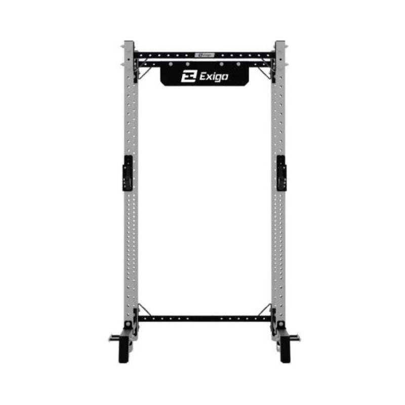 The EXIGO X70 Half Rack by Exigo is a freestanding silver and black unit for commercial gyms, featuring multiple adjustment holes, barbell hooks, and a branded nameplate at the top for strength training.