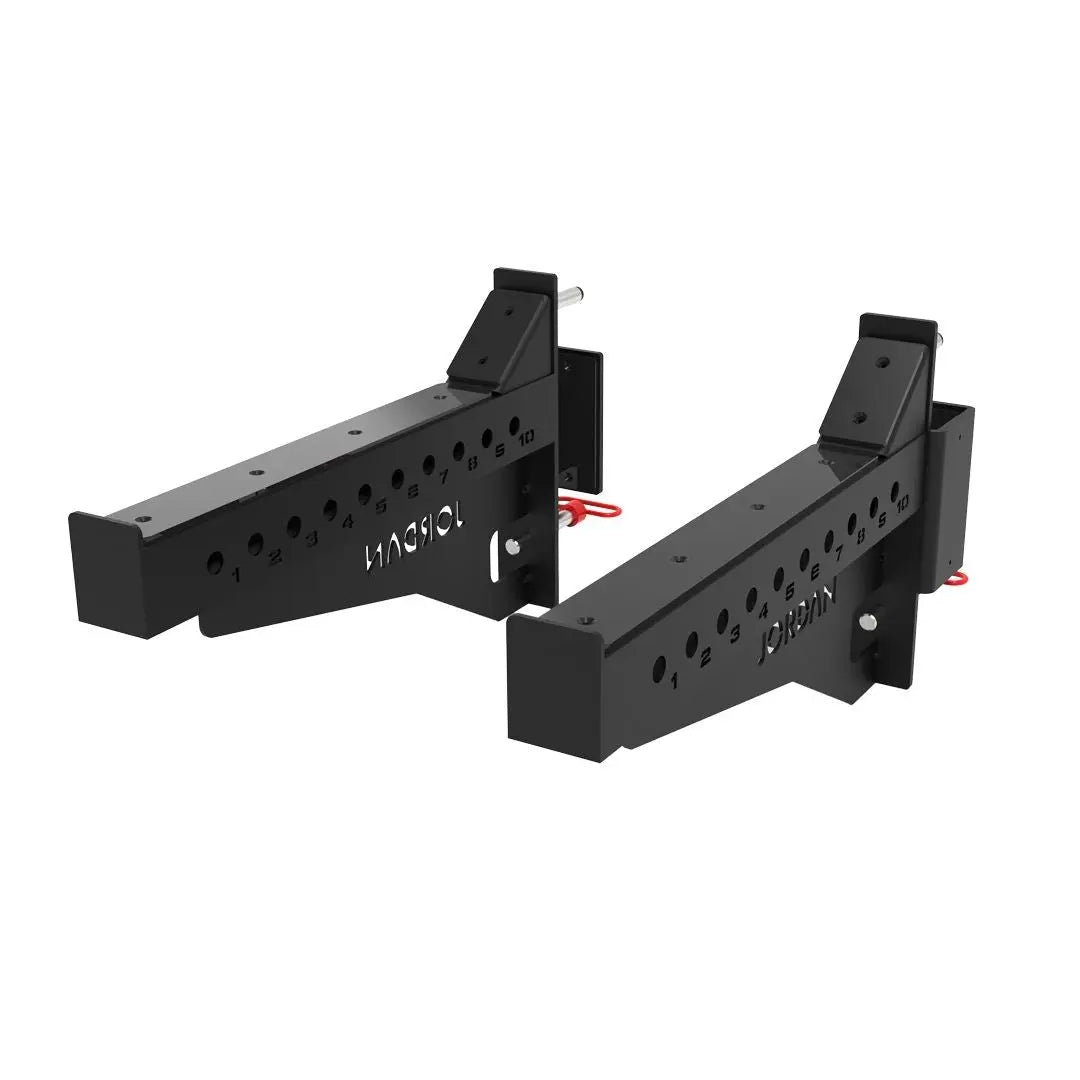 JORDAN® J75 Safety Spot Arms are black adjustable steel brackets with multiple holes and locking pins, providing commercial-grade heavy lift protection for barbells on Jordan racks or supporting gym equipment attachments.