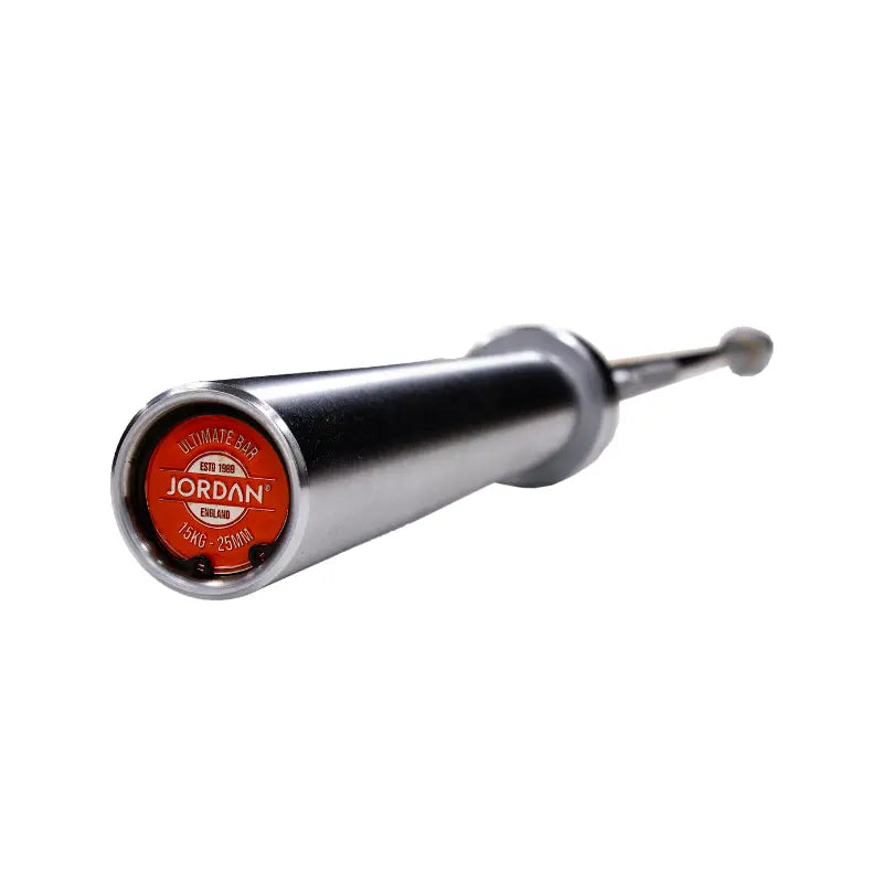 Close-up of the end of a silver Jordan Ultimate Olympic Bar—competition standard, 20kg, 28mm—showing a black cap with the brand name. The barbells durable shaft fades out of focus.