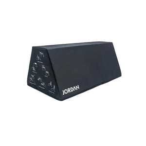 The JORDAN Soft Hip Thrust Bench is a black, rectangular EVA foam platform with the brand name on the side and workout illustrations—ideal for glute and strength exercises like hip thrusts.