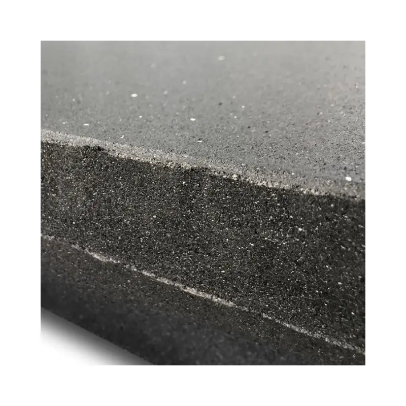 Close-up of the MYO Strength Heavy-Duty Rubber Gym Flooring Tile (1000x1000x40mm) by MYO Strength, showing its thick, textured black surface with tiny specks—perfect for shock-absorbing protection in gym environments.