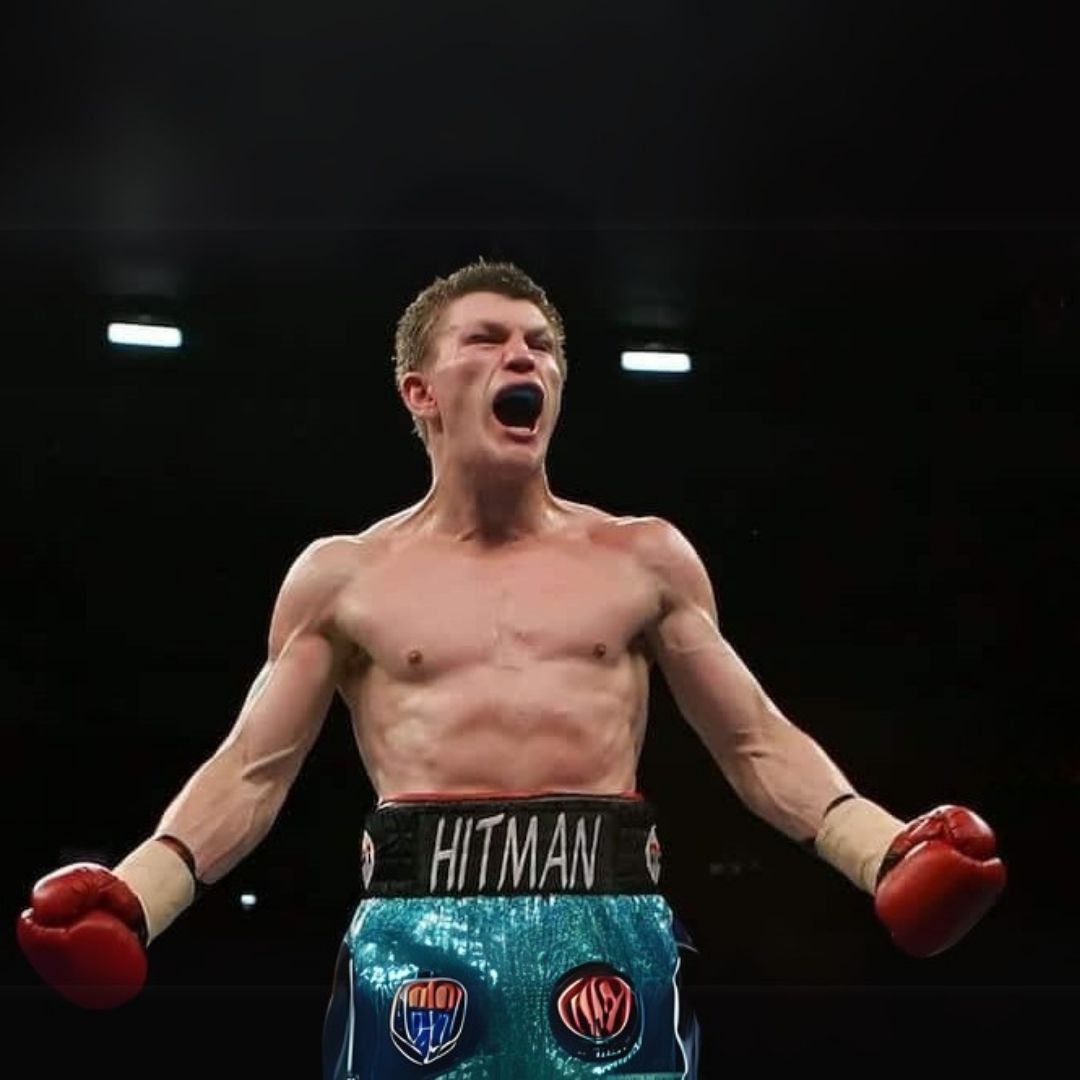 Ricky Hatton in a boxing ring with 'Hitman' on his shorts