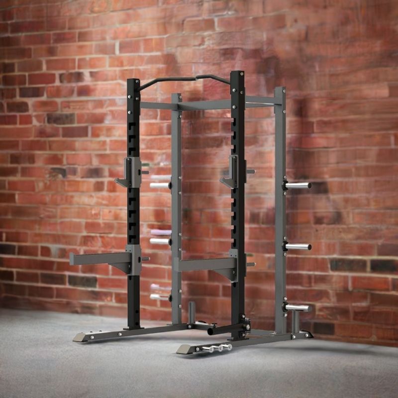 The MYO Strength Half Rack, in black and gray, offers multiple barbell holders, weight pegs, safety bars, and a pull-up bar. Its an ideal versatile setup by MYO Strength for home gym strength training.