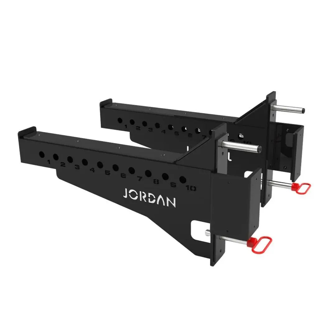 Positioned in parallel, the JORDAN J75 Safety Sport Arms Attachment (pair) features two black metal brackets with multiple holes, red wires, and an angled rectangular base. The Jordan brand name is visible in white, ensuring reliability for heavy lifting in strength training setups.
