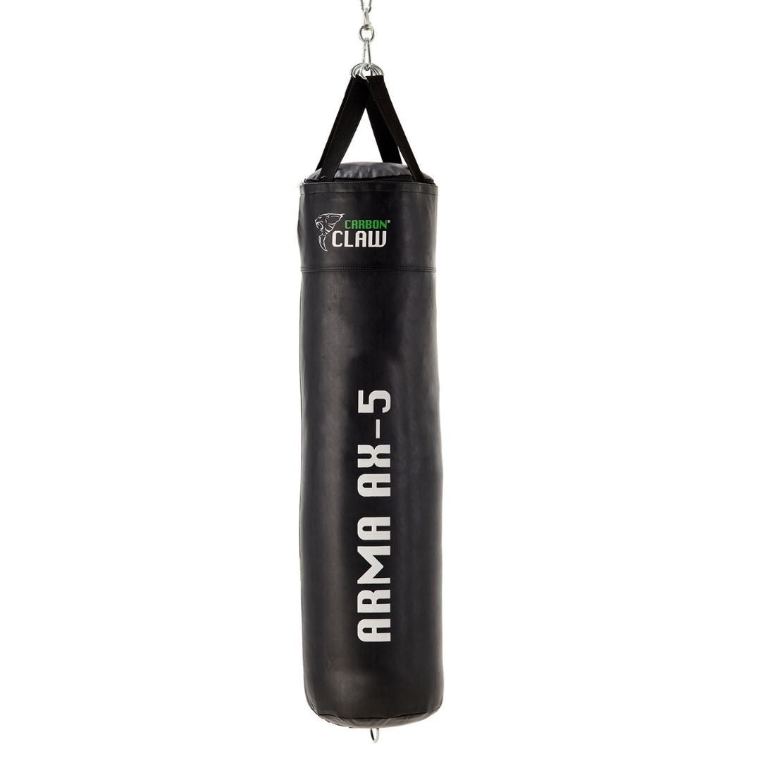 The CARBON CLAW - ARMA Punchbag, 4ft x 13 and weighing 27kg, hangs from a chain. Its black and white with a green accent, proudly featuring the Carbon Claw logo and a claw image—an ideal addition for boxing enthusiasts fitness routines.