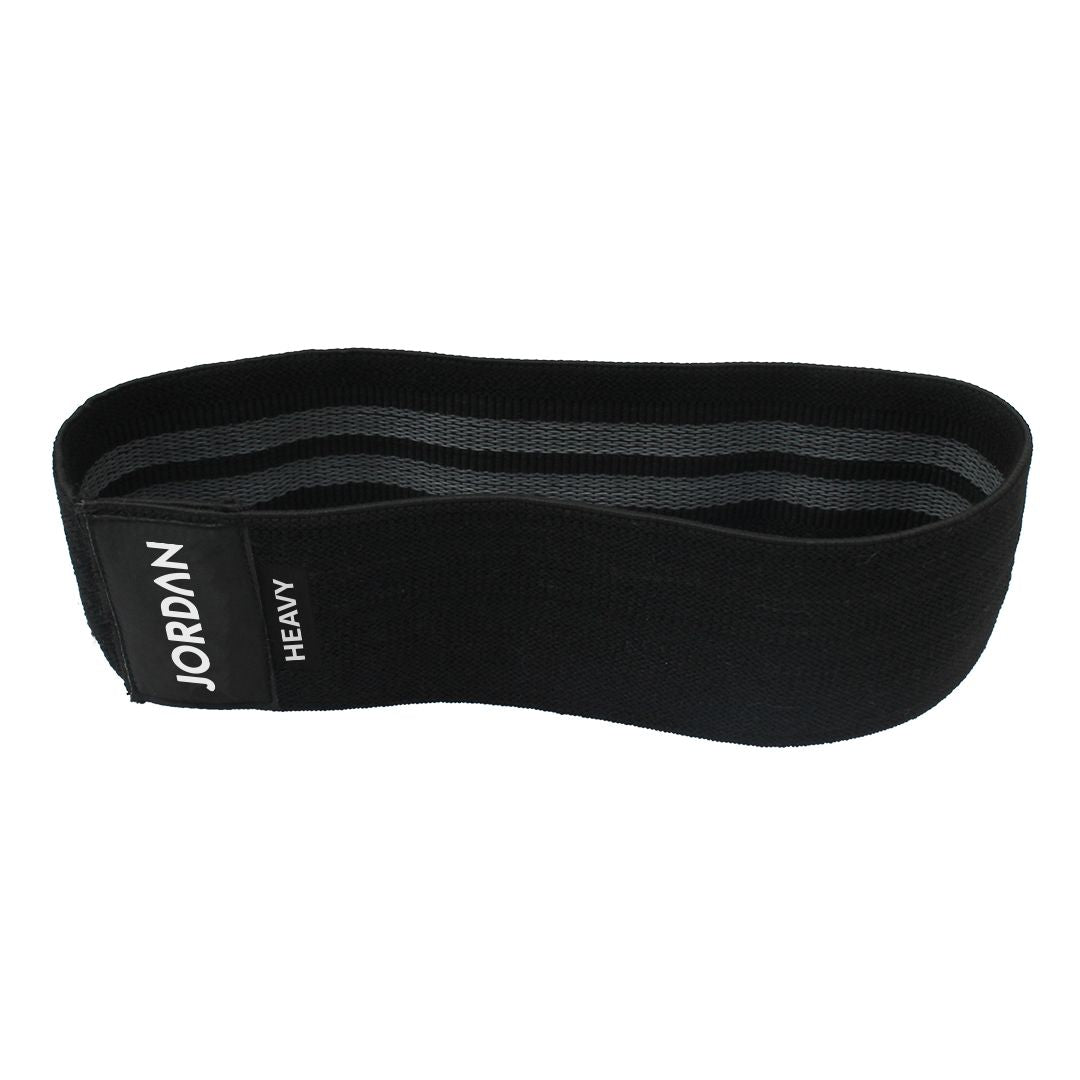 The JORDAN Fabric Resistance Band is red with Jordan and Medium on a black label, offering a smooth texture and moderate elasticity. Its durable design makes it perfect for fitness and strength training, providing versatile workout options.