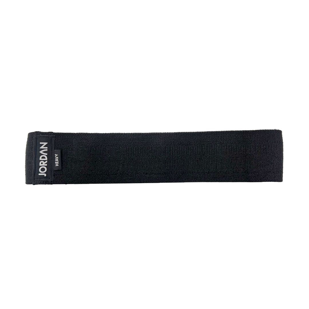 The JORDAN Fabric Resistance Band is red with Jordan and Medium on a black label, offering a smooth texture and moderate elasticity. Its durable design makes it perfect for fitness and strength training, providing versatile workout options.