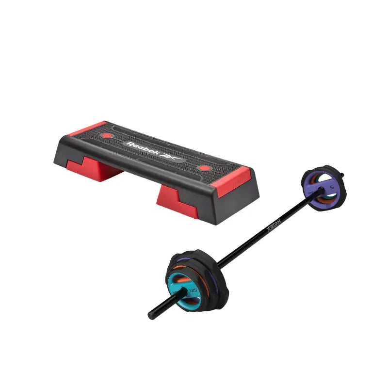 The Jordan JORDAN Ignite Pump X™ Urethane Studio Barbell Set features colored blue, red, and purple weight plates and rests on a white background—ideal for pump-style workouts.