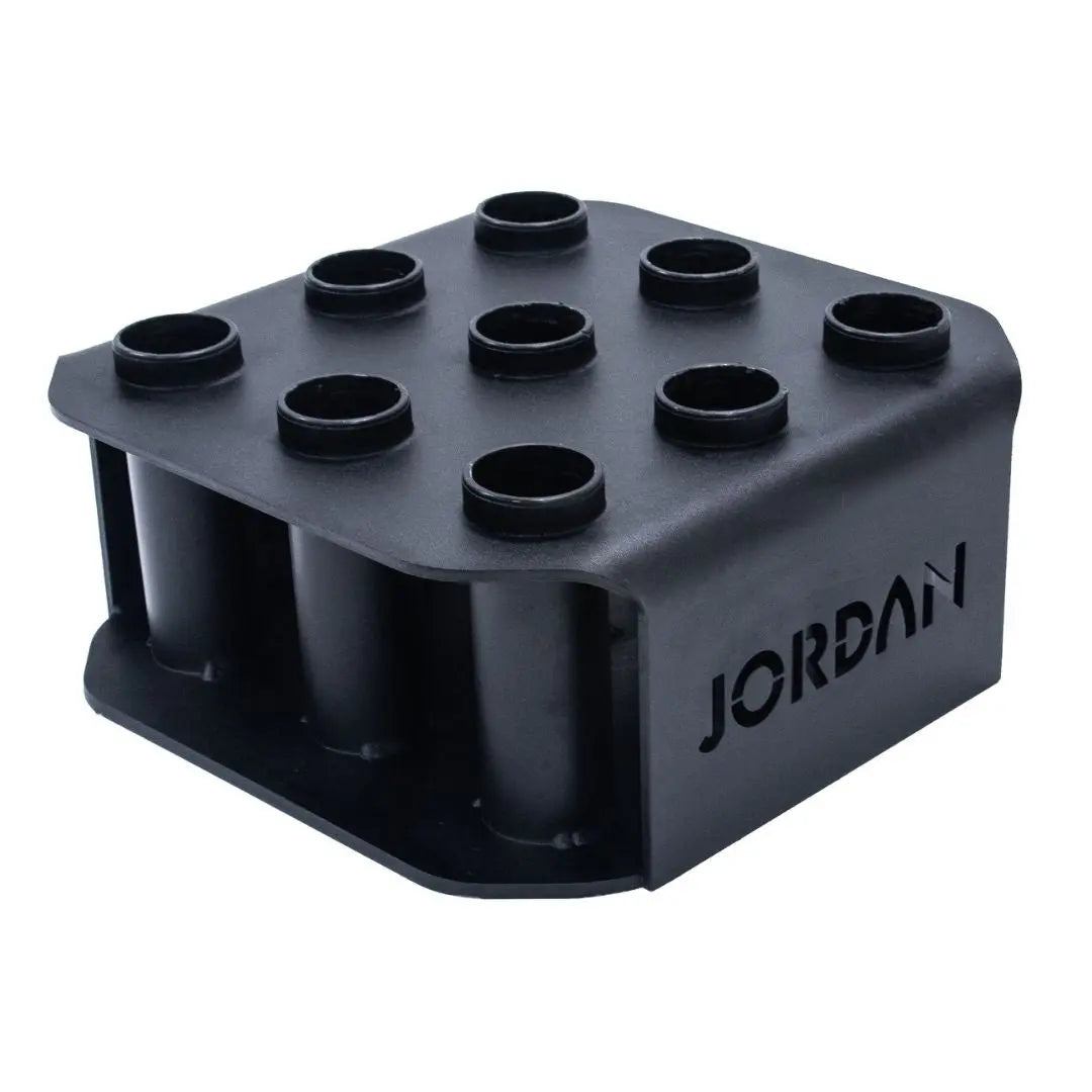 A black, square sneaker display holder with nine round slots and the word JORDAN cut out on the side. The holder is designed to organize or showcase items vertically.