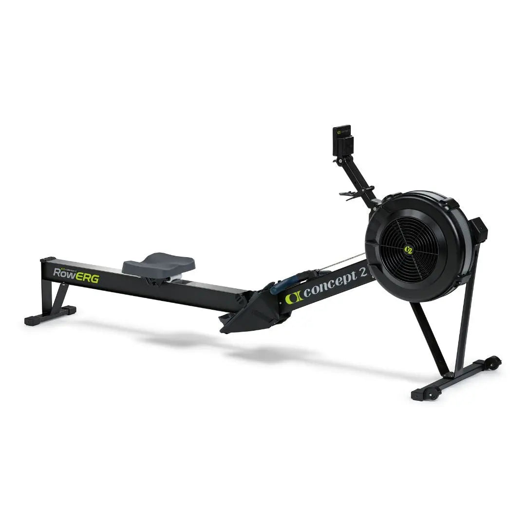 A black Concept2 RowErg indoor rowing machine with a flywheel, central rail, sliding seat, and digital monitor, positioned on a white background.