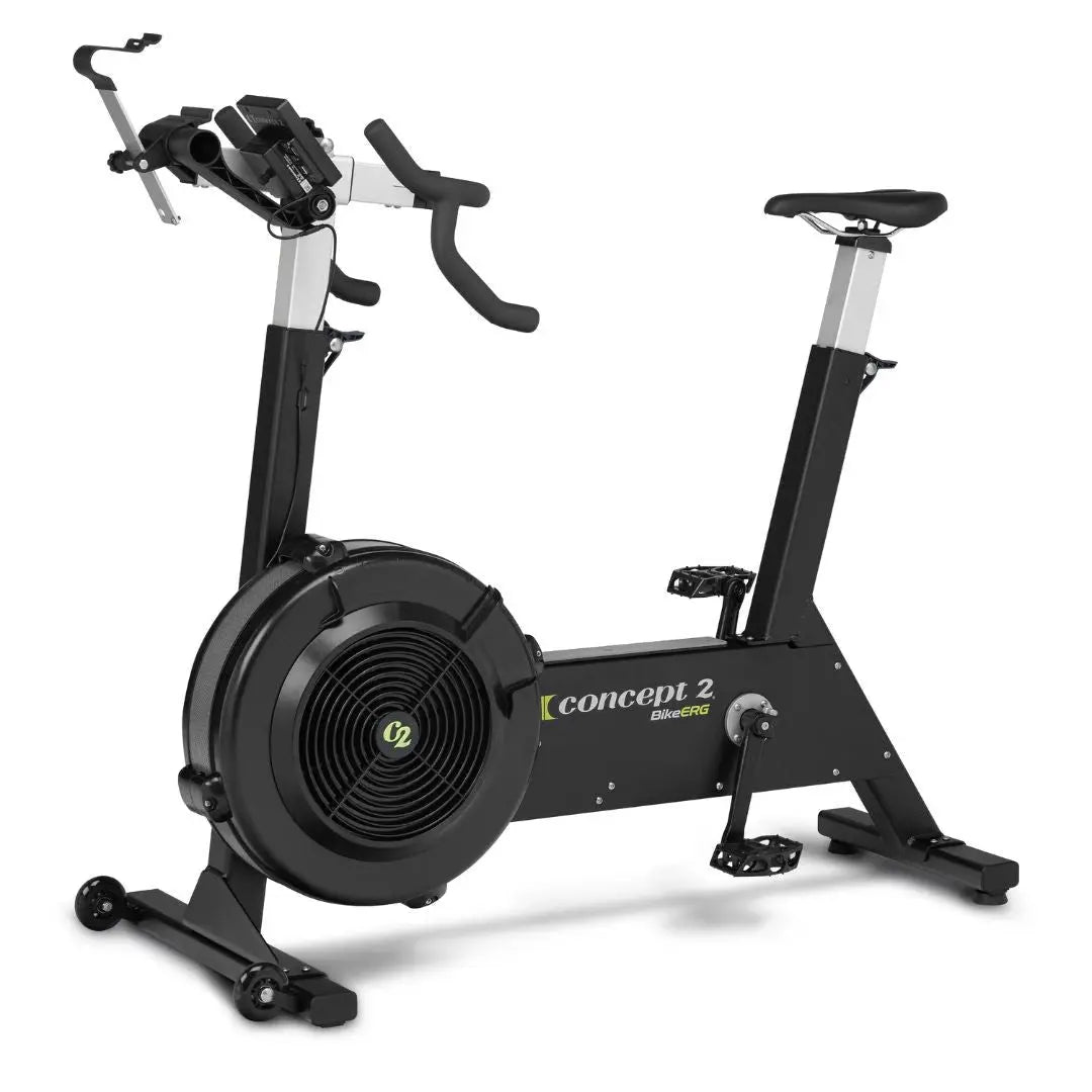 A black Concept2 stationary exercise bike with adjustable seat, handlebars, digital display, and a large front flywheel, designed for indoor cycling workouts.