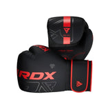 A pair of black RDX boxing gloves with red accents and branding, featuring a modern design and secure wrist straps, positioned to show both the front and side views.