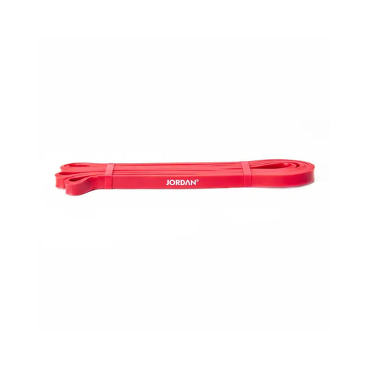 The JORDAN Power Band, a heavy-duty red resistance band with JORDAN in white text, is ideal for strength, speed, and mobility training. It’s shown laid flat on a white background.