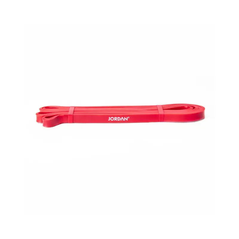 The JORDAN Power Band, a heavy-duty red resistance band with JORDAN in white text, is ideal for strength, speed, and mobility training. It’s shown laid flat on a white background.