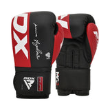 A pair of black and red RDX boxing gloves with white lettering and logos, shown upright with one glove facing forward and the other showing the palm side.