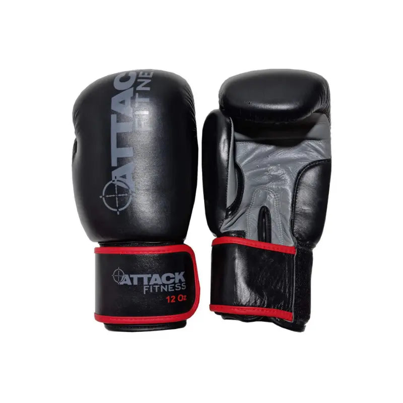 A pair of black ATTACK Fitness - Boxing Gloves Leather, 12 Oz, with red trim, shown with one gloves top and the others palm visible—ideal for sparring or training.