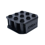 The JORDAN Olympic Bar Holder by Jordan is a black, rectangular rack with nine vertical slots for organizing Olympic bars upright, featuring the brand name cut out on the side.