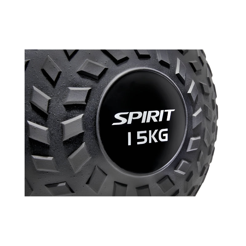 Close-up of a black exercise slam ball with a textured surface. The center label reads "SPIRIT 15KG" in white text, indicating the brand and weight of the ball.