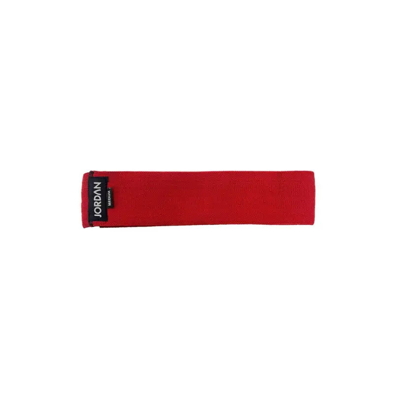 The JORDAN Fabric Resistance Band is a non-slip booty band for squats, lunges, and glute workouts. Shown in red with a black Jordan Medium label against a white background.