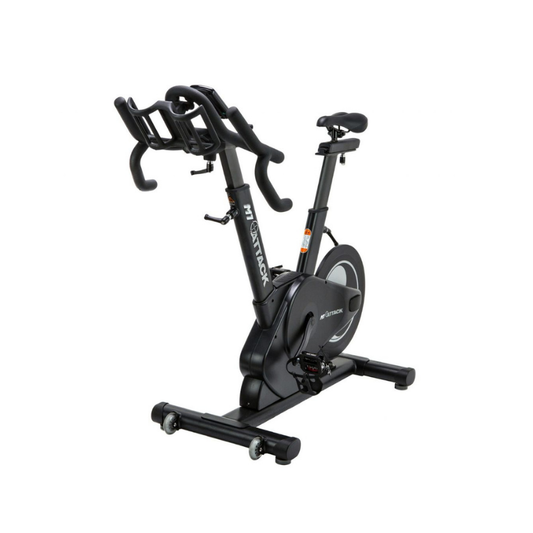 The Attack Fitness M1 Magnetic Studio Bike by Attack Fitness is a black belt-driven indoor cycle with console, featuring an adjustable seat, handlebars, and large flywheel—ideal for indoor cycling workouts against a white background.