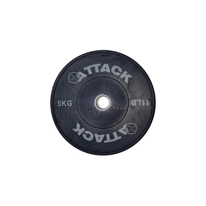 The ATTACK Strength Olympic solid rubber black bumper plate by Attack Fitness features ATTACK with an anarchy symbol for the A, marked 5 KG and 11 LB. Its ideal for weightlifting and strength training with a silver center.