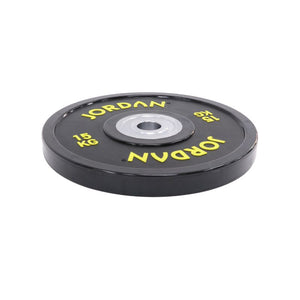 The JORDAN Urethane Olympic Competition Plate by Jordan is a black plate with yellow "JORDAN" lettering and "15 KG," featuring competition-grade accuracy and a silver centre hole for barbell mounting.
