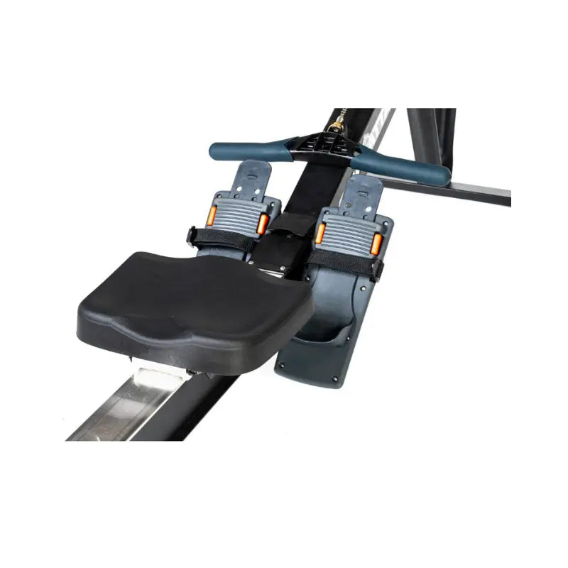 The Attack Fitness Indoor Rowing Machine offers low-impact, full-body cardio with a Bluetooth console and digital display—ideal for home workouts. Shown in black with footrests and flywheel against a white background.