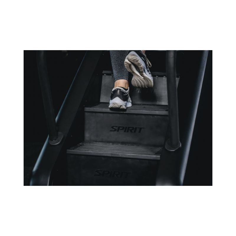 Person stepping onto a  Stair Climber with 'Spirit' branding