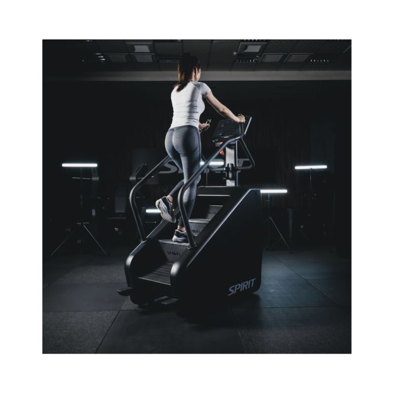 Person using a Stair Climber machine in a gym setting with 'Spirit' branding.