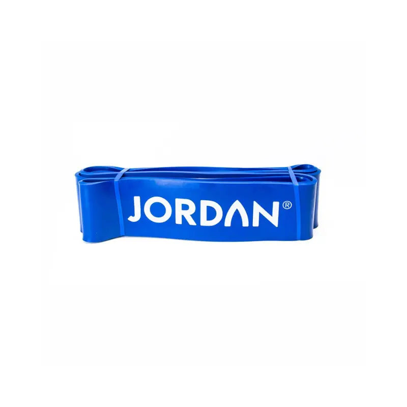 The JORDAN Power Band, a heavy-duty red resistance band with JORDAN in white text, is ideal for strength, speed, and mobility training. It’s shown laid flat on a white background.