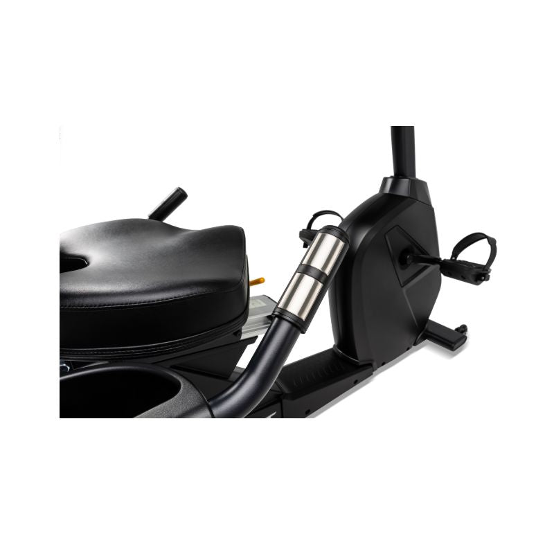 Close-up of a black and silver recumbent exercise bike on a white background