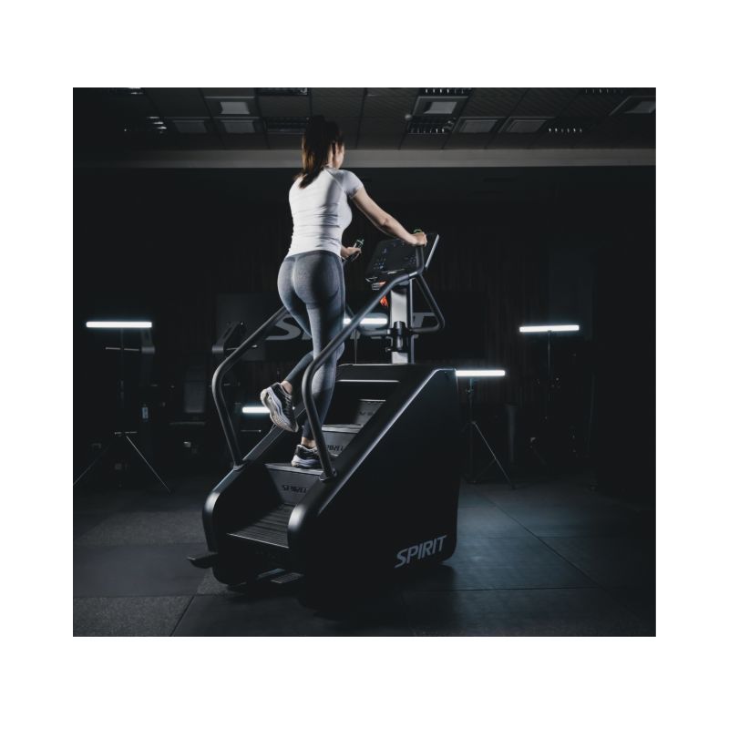 Person using a  Stair Climber machine in a gym setting
