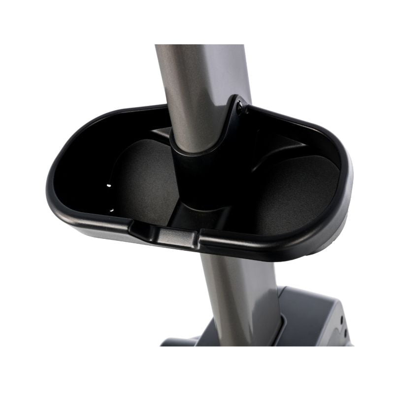 Close-up of a black and grey elliptical trainer cup holder on a white background